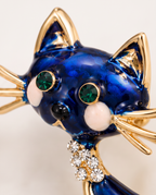 Close up of the green crystal eyes and rhinestone collar
