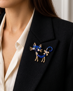 The Midnight Cat Brooch worn on the lapel of a black blazer