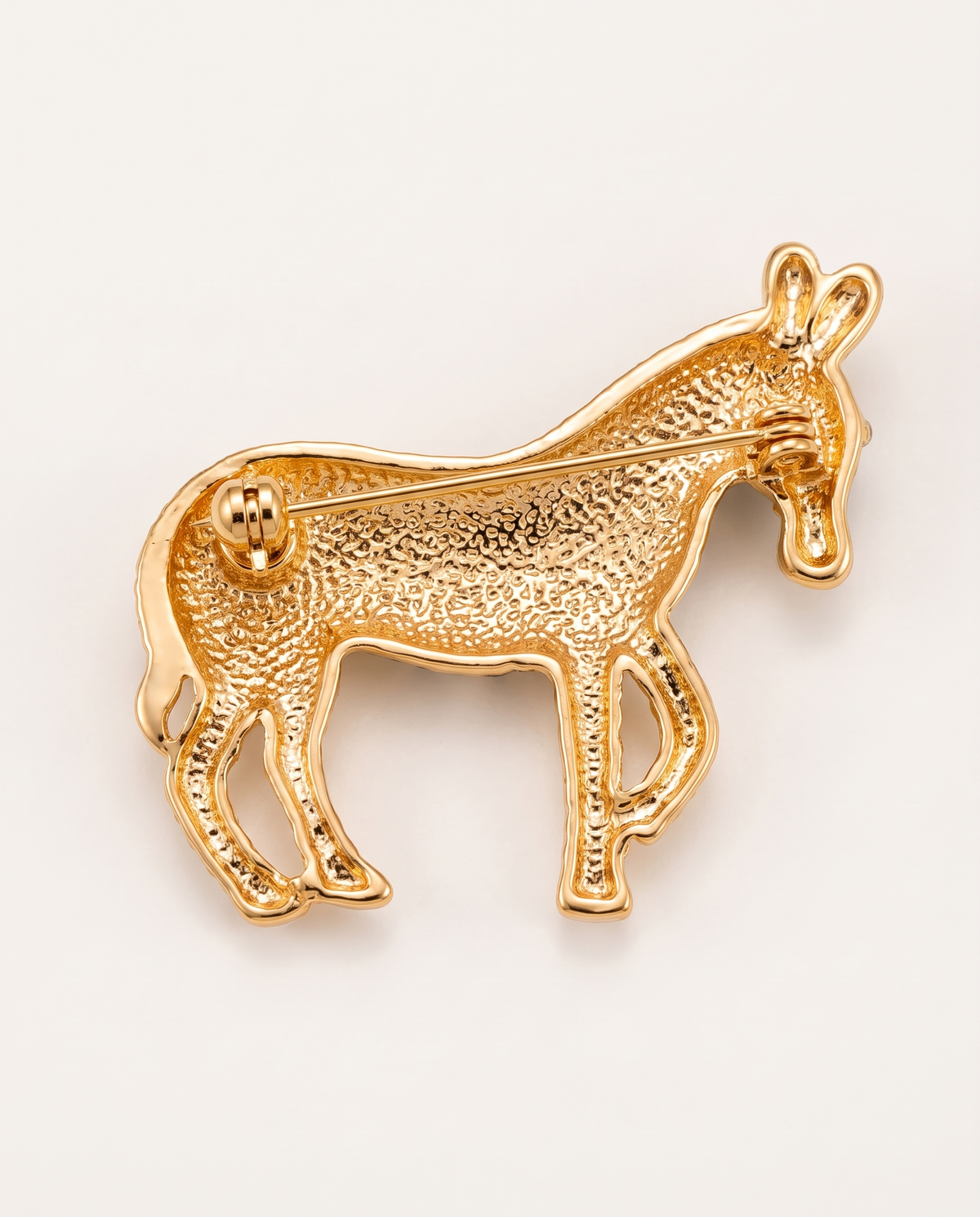 Back of the brooch showing the pin and safety clasp