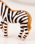Close up of the beaded gold mane and striped enamel body