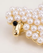 Close up of the gold face and pearl fleece