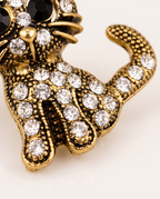 Close up of the rhinestone body and curled tail