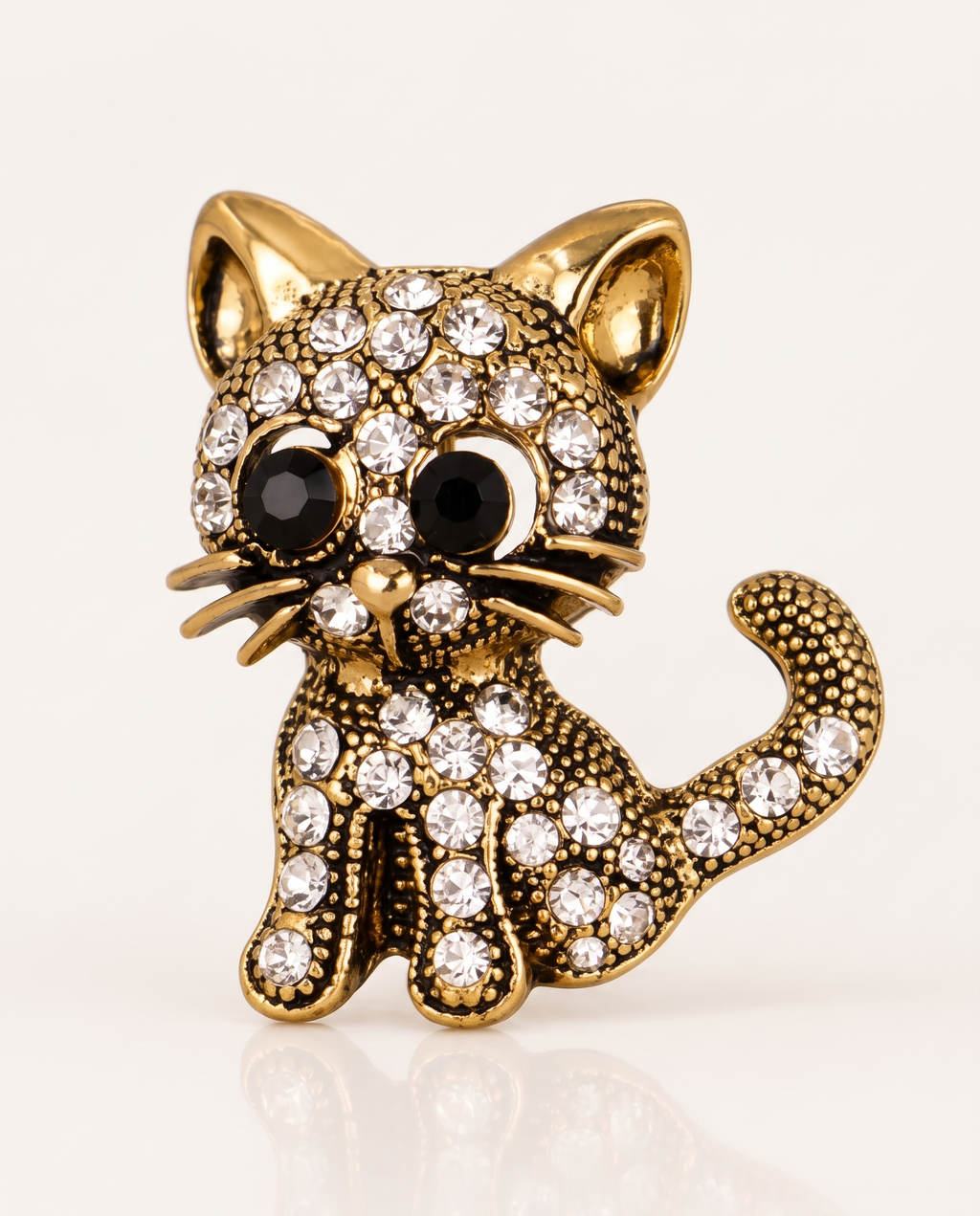 The Diamante Cat Brooch in antique gold with clear rhinestones