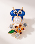 The Garden Owl Brooch in blue enamel with pearl, flower and crystals