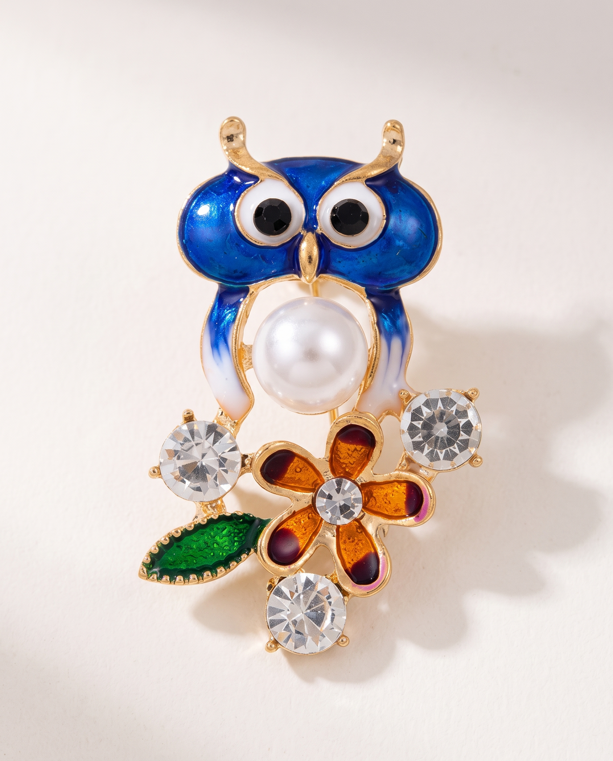 The Garden Owl Brooch in blue enamel with pearl, flower and crystals