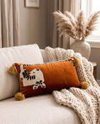 The leopard Menagerie Cushion on a cream sofa