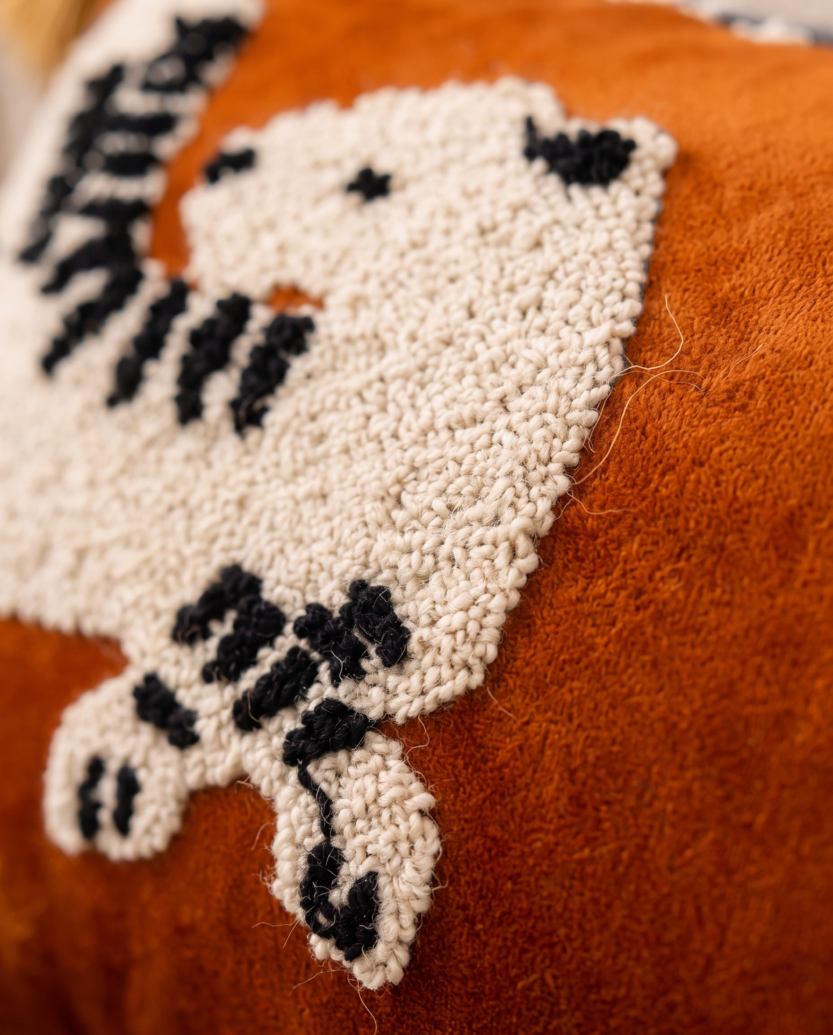 Close up of the hand tufted leopard