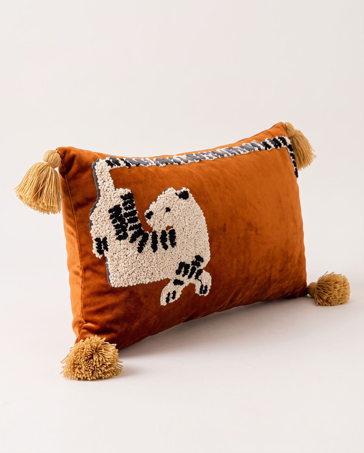 The leopard Menagerie Cushion from an angle