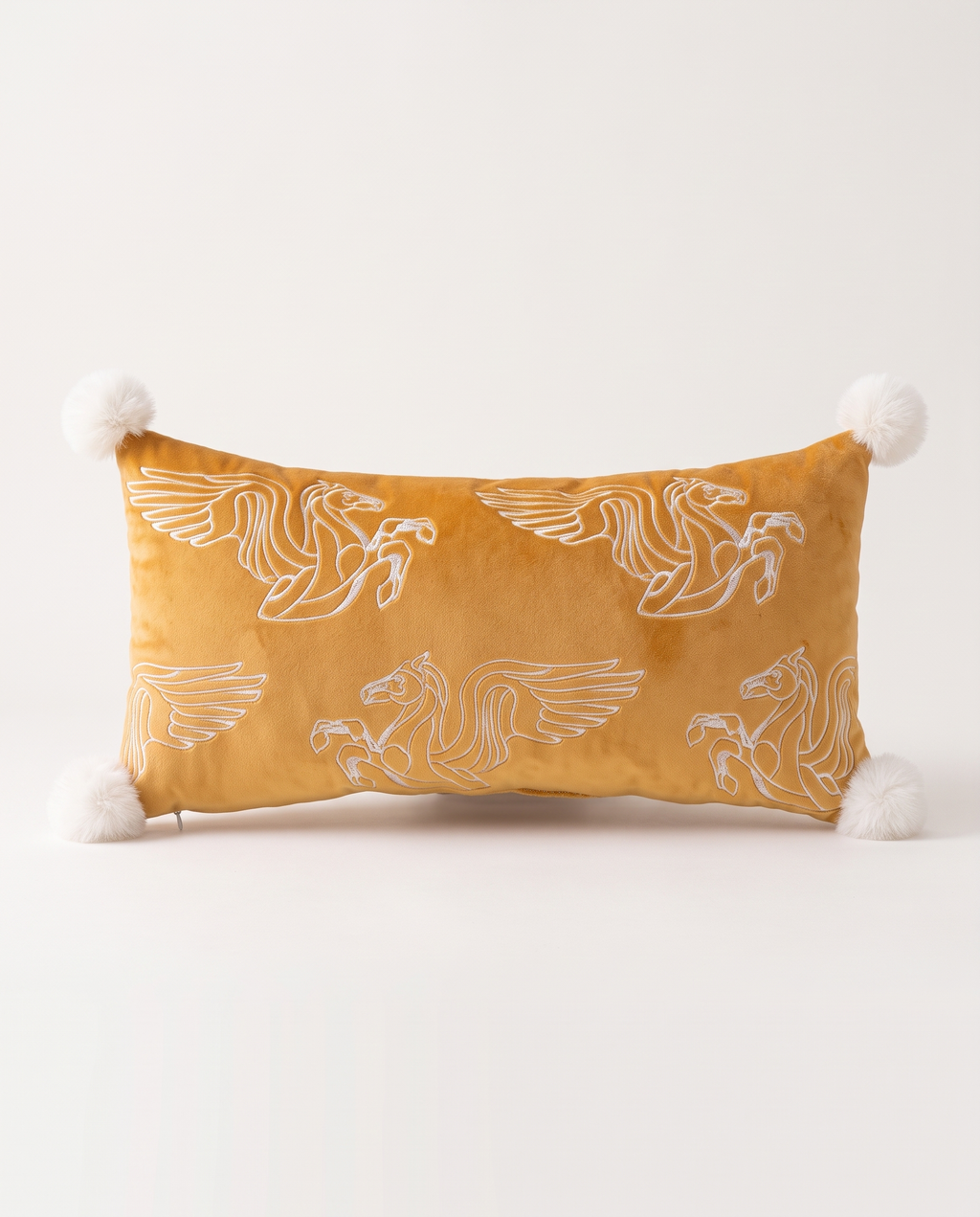 The Menagerie Cushion with winged horses on mustard velvet