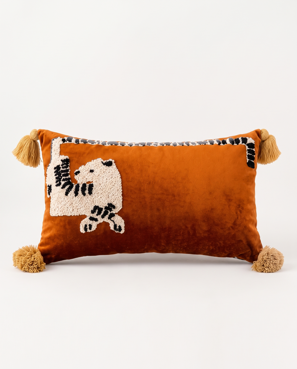 The Menagerie Cushion with tufted leopard on rust velvet