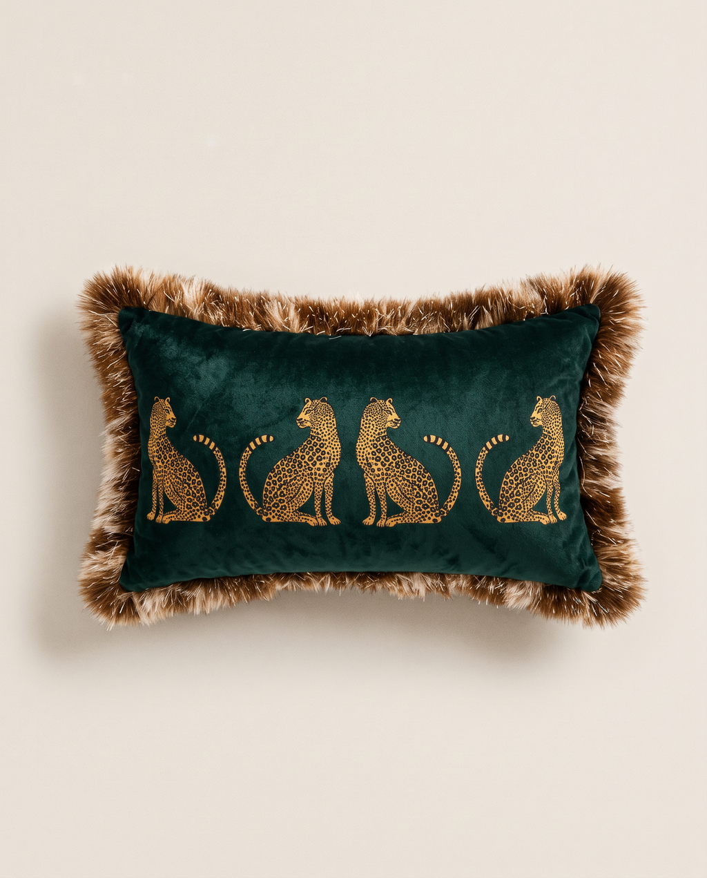 The Cheetah Parade Cushion in dark green velvet with fluffy fringe