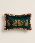 The Cheetah Parade Cushion in dark green velvet with fluffy fringe