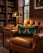 The Cheetah Parade Cushion on a leather armchair