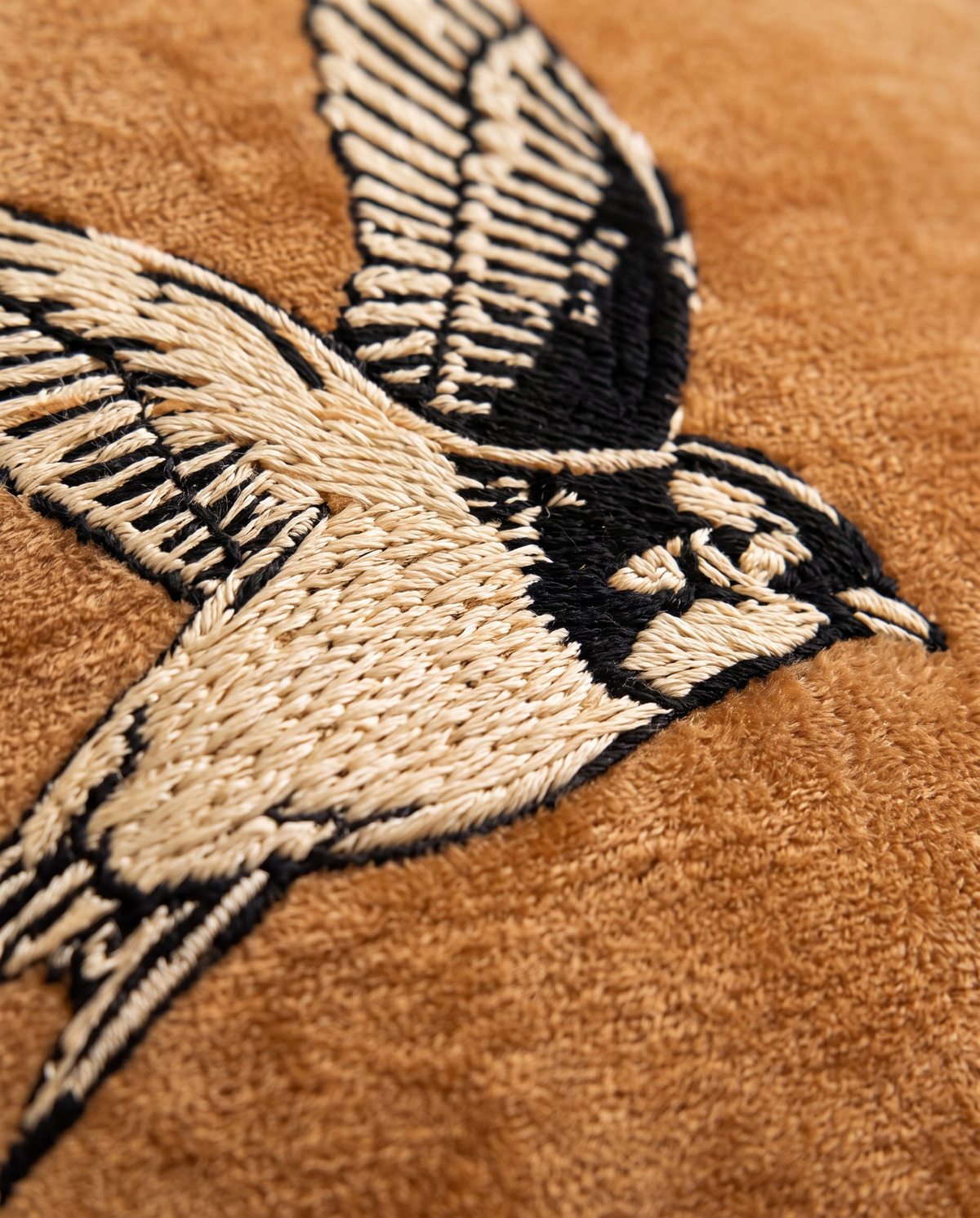 Close up of the embroidered swallow