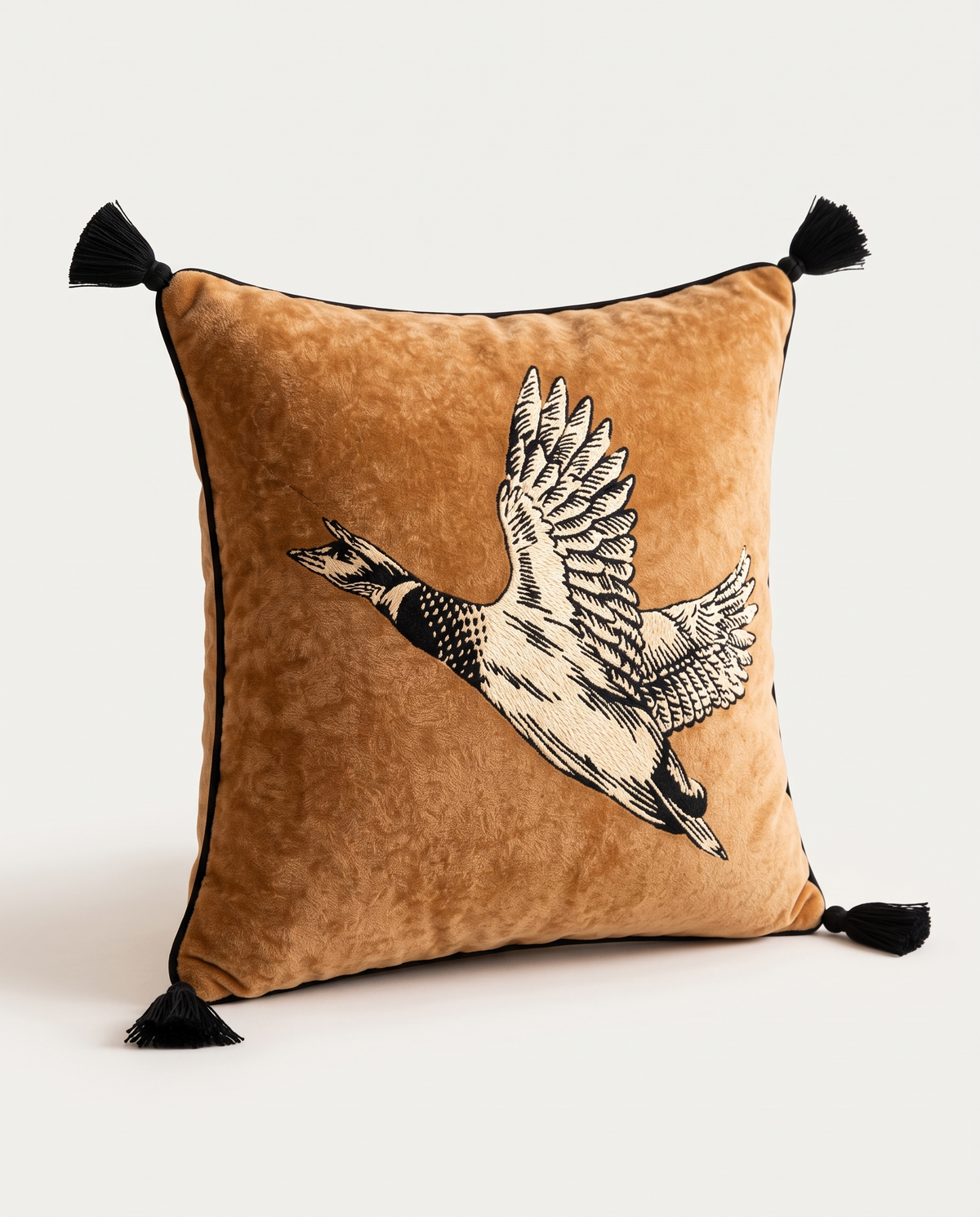 The reverse of The Migration Cushion with embroidered flying goose