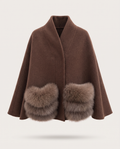 A brown shawl cape coat featuring large, fluffy faux-fur trim at the hem, displayed against a light gray background.