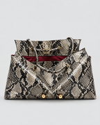 The Milano Tote in black python, open to show the inner panel and handles
