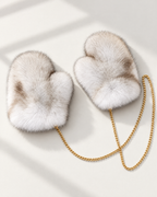 The St. Moritz Fur Mittens in natural fox fur on a gold chain
