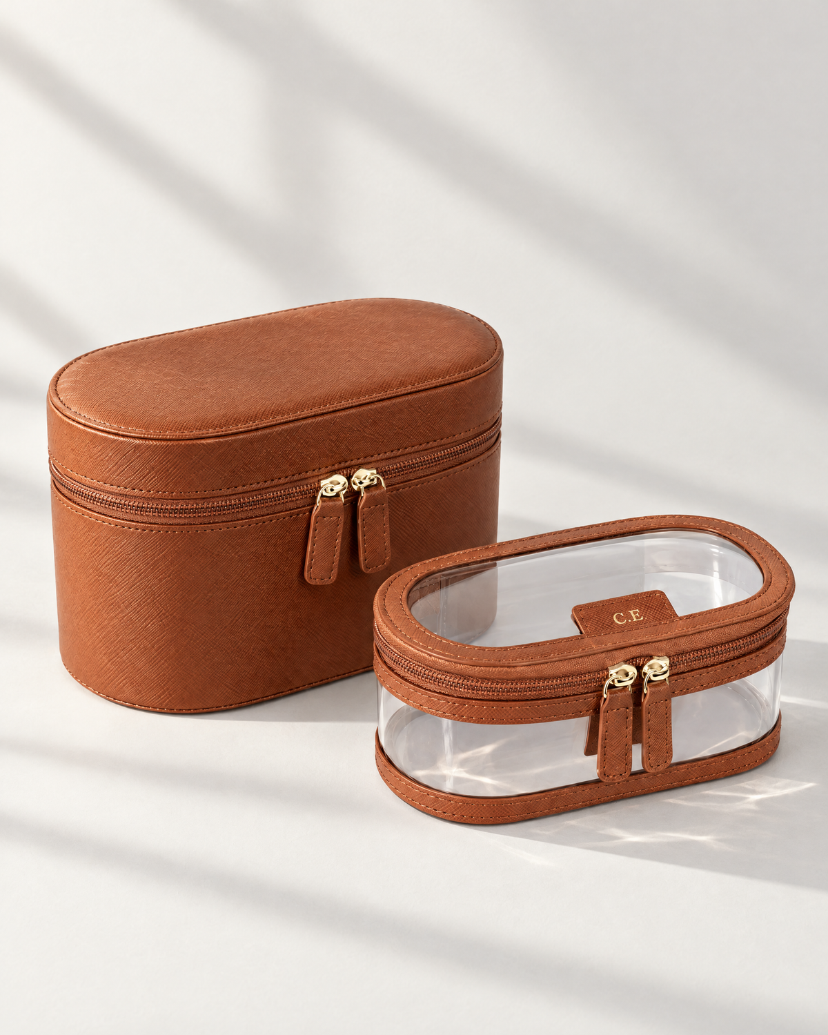The Riviera Vanity Case in tan saffiano with clear inner bag