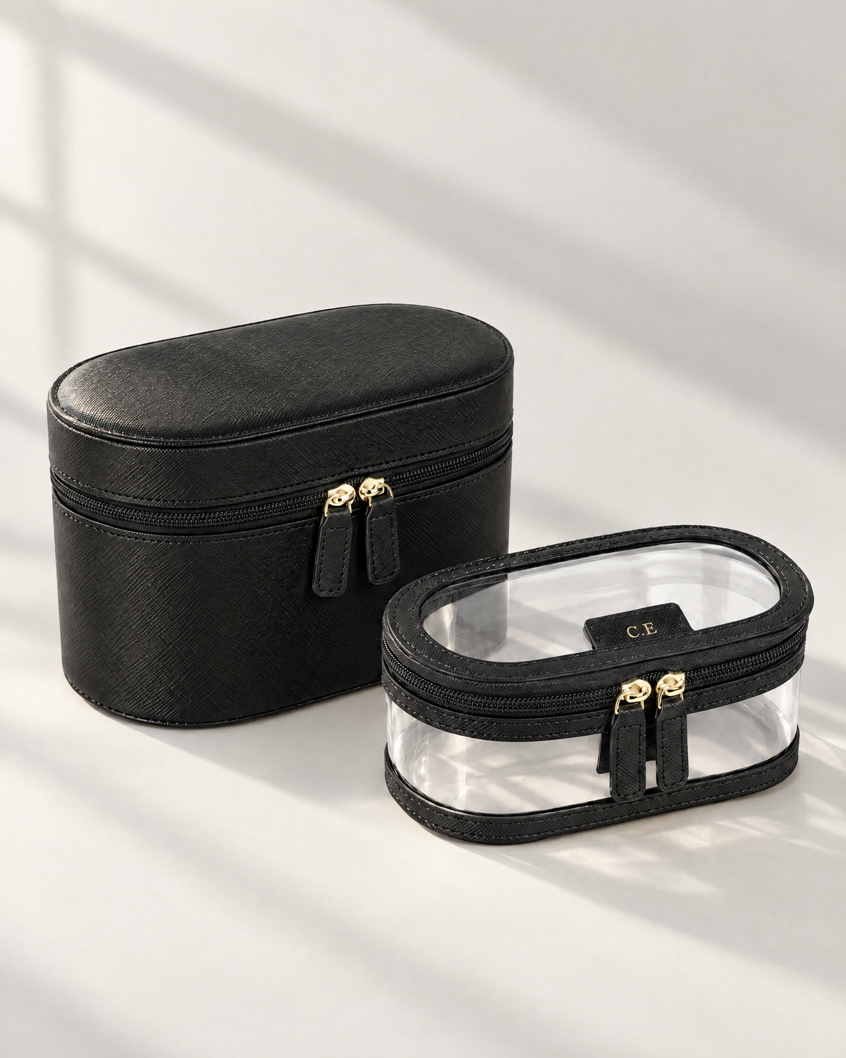 The Riviera Vanity Case in black saffiano with clear inner bag