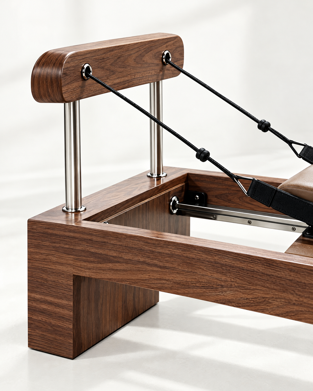 Walnut headboard, stainless steel posts and ropes of The Belgravia Reformer