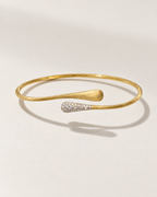 The Amalfi Cuff in brushed gold with pavé teardrop tip