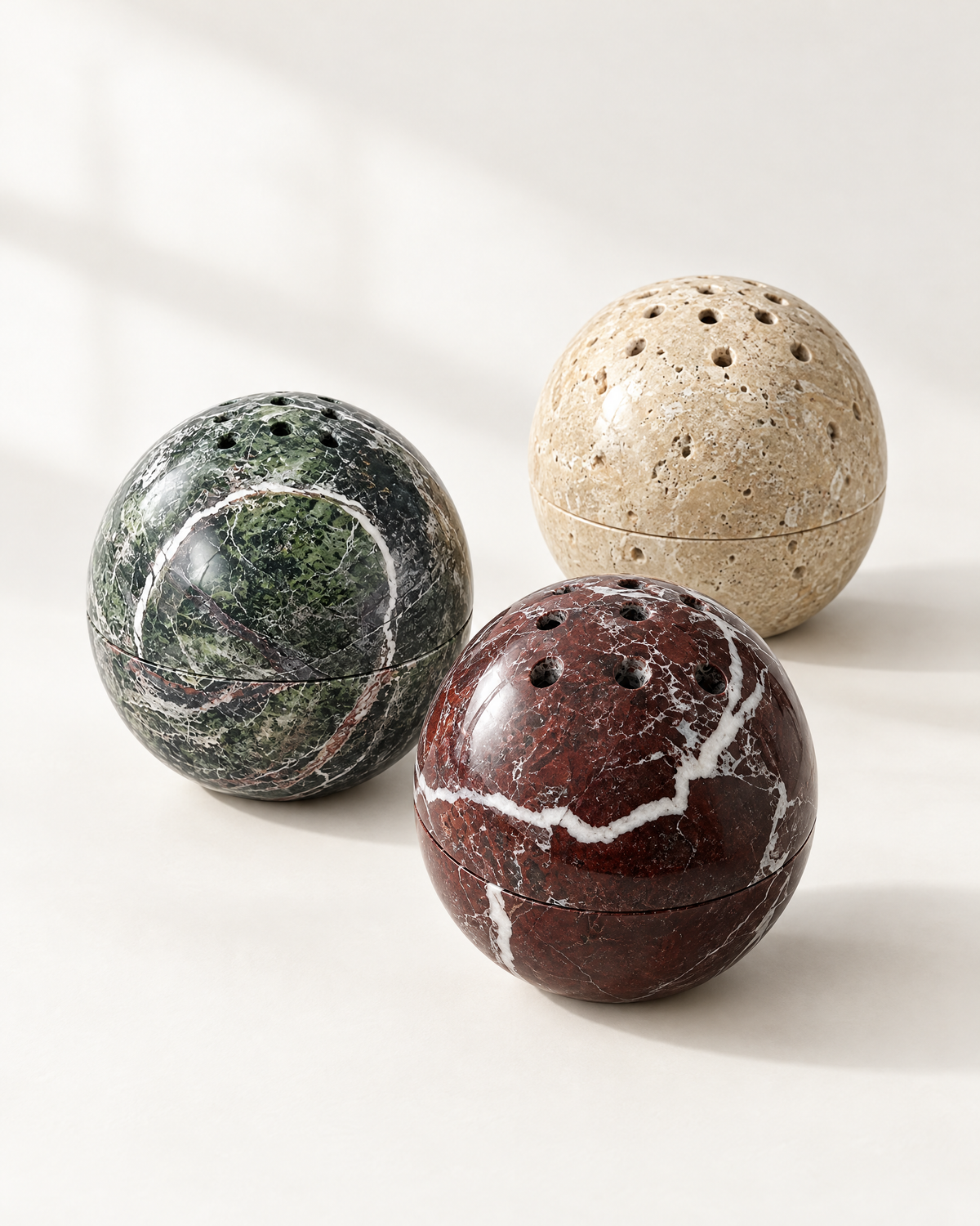 The Carrara Incense Sphere in Verde Alpi, Ivory Travertine and Rosso Levanto