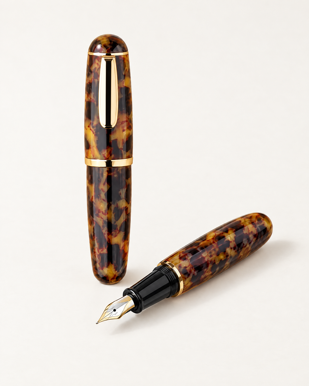 The Bloomsbury Pocket Pen in tortoiseshell resin, capped and uncapped