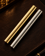 Gold and silver Piccadilly Lighters on leather