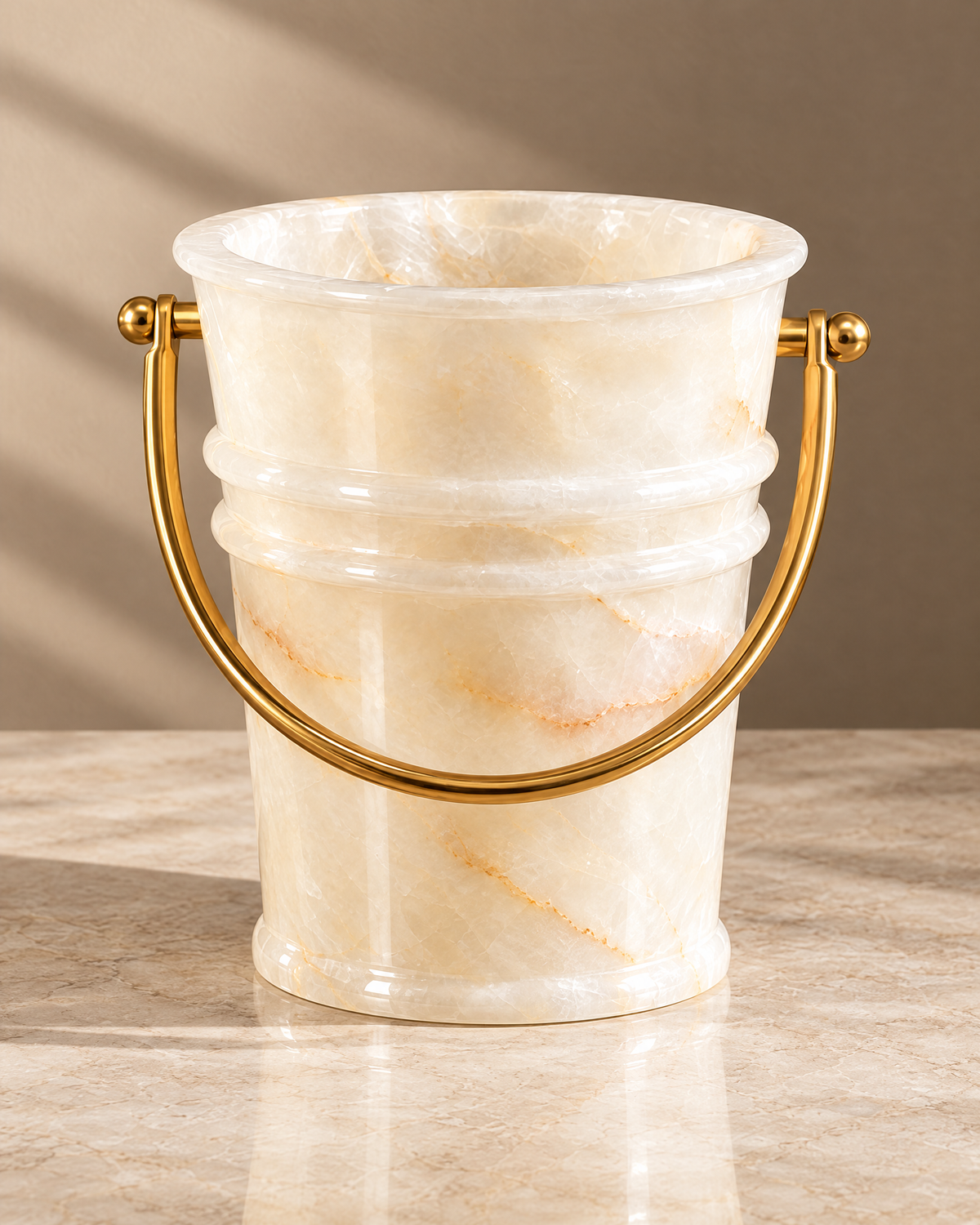 The Savoy Ice Bucket in white onyx with brass handle