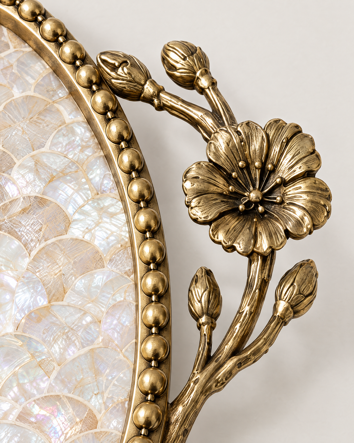 The Positano Tray brass flower handle close-up